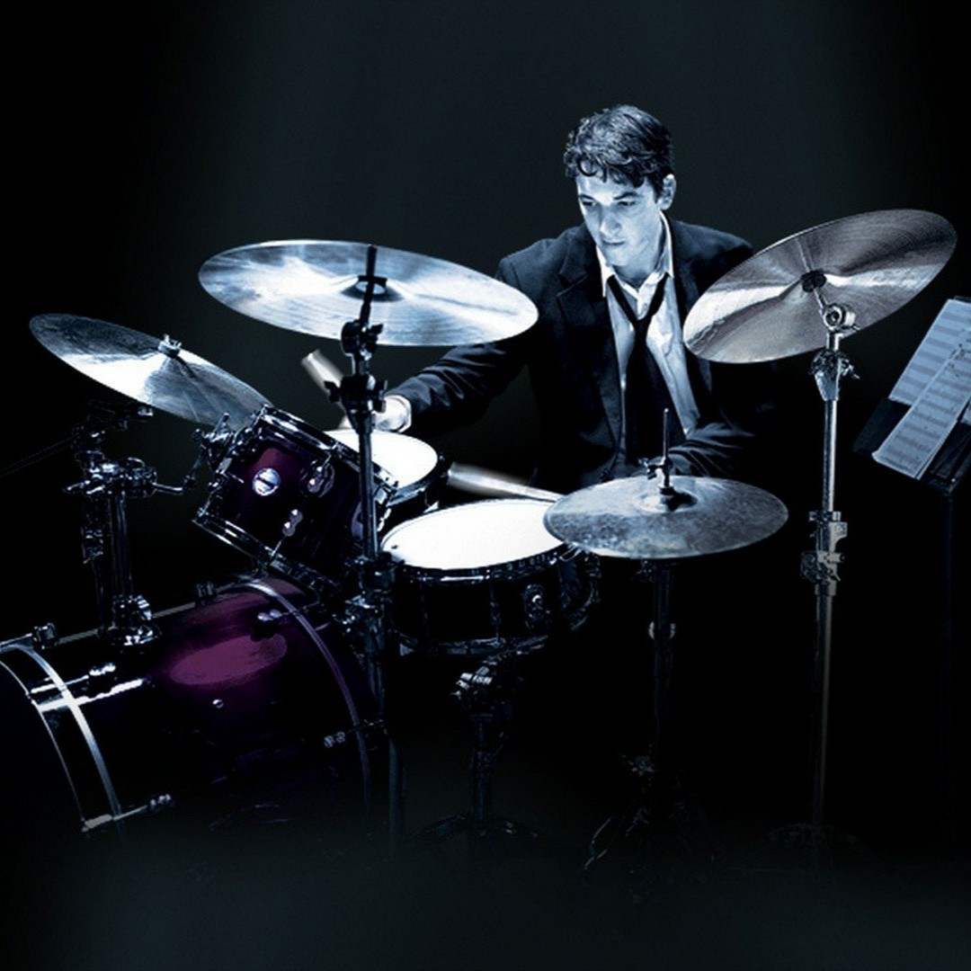 Myles Teller drumming on movie cover of whiplash released in 2014